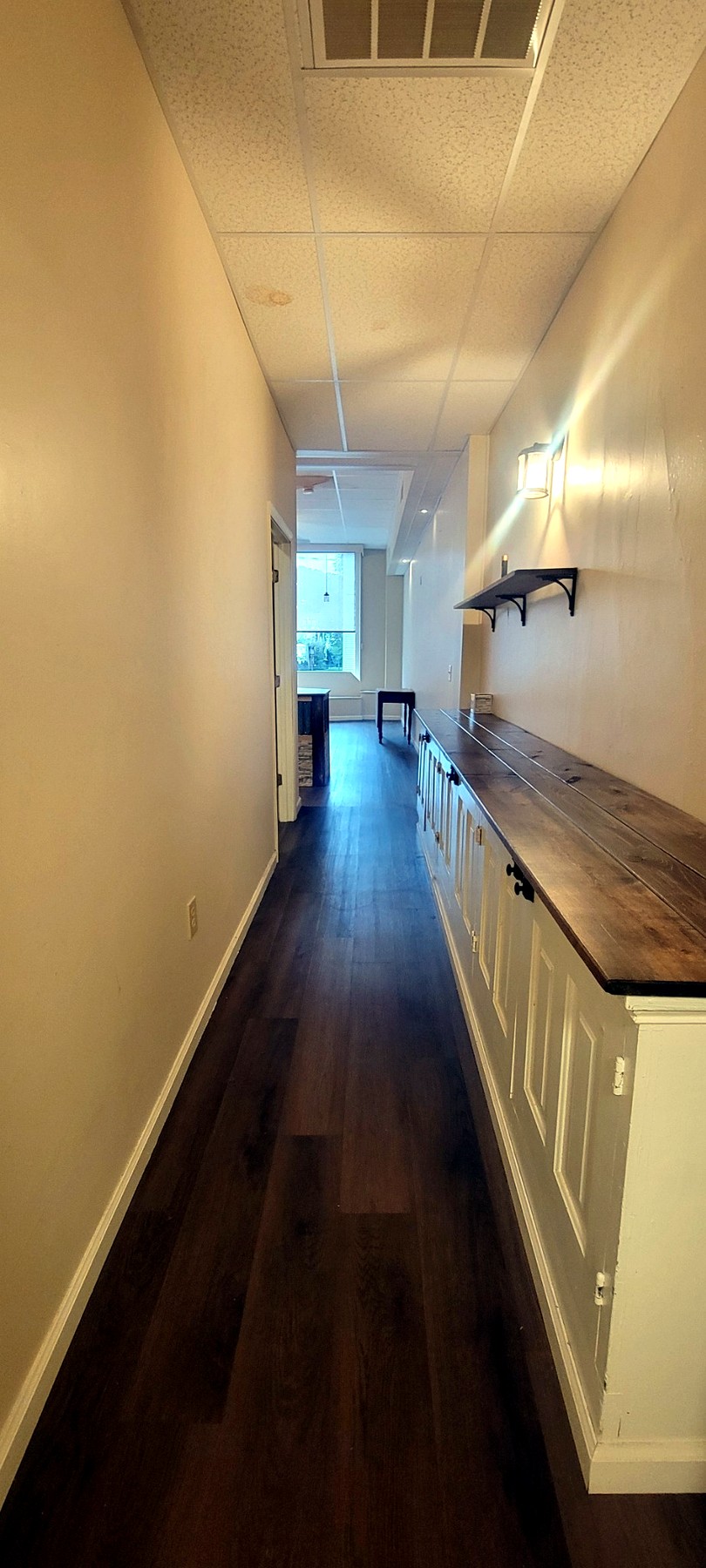 Hallway along built-in cabinetry
